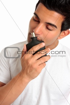 Man smelling aftershave cologne