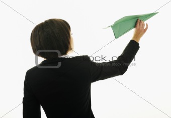 business woman throwing  paper airplane 