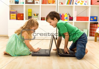 Kids playing on laptops