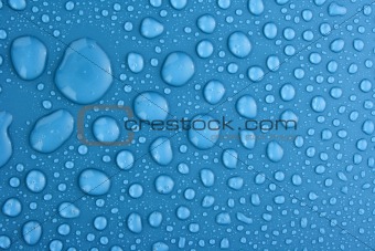 Blue water drops background with big and small drops 