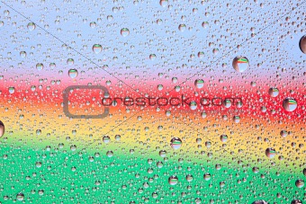 Rainbow water texture on a glass