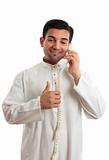 Happy ethnic businessman on phone