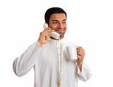 Traditional ethnic business man talking on telephone