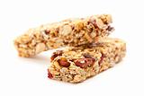 Two Nutritious Granola Bars Isolated on White with narrow Depth of Field. 
