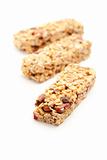 Three Granola Bars Isolated on a White Background with Narrow Depth of Field.