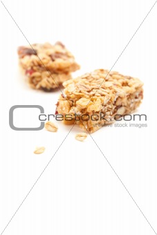 Broken Granola Bar Isolated on a White Background with Narrow Depth of Field.