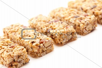 Row of Several Granola Bars Isolated on a White Background with Narrow Depth of Field.