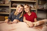 Cute young girls in a clay studio