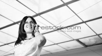 young happy business woman talking by cellphone