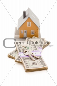 Home and House Keys on Stack of Money Isolated on a White Background - Cash for Keys Program.