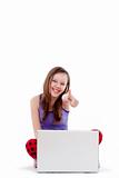happy girl with laptop showing thumbs up - isolated on white