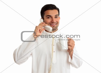 Friendly smiling ethnic businessman on telephone