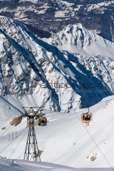 Gondola lift on high mountain ski resort