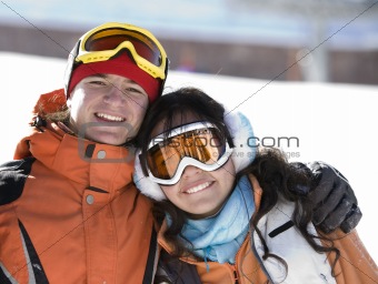 Lucky couple  snowboarders  in a mountain 