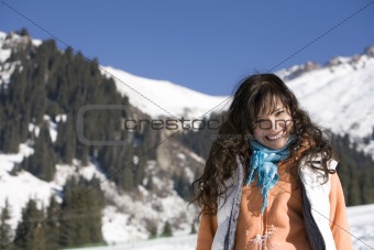 Woman at the winter mountains