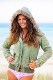 Smiling Young Woman in Swimsuit and Hooded Coat