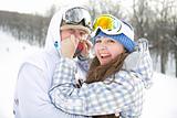 Happy couple of snowboarders
