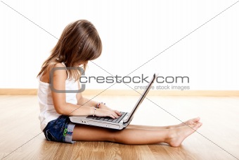 Child playing with a laptop
