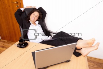 Young woman relaxing at work 