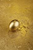 Gold Easter egg on a golden background
