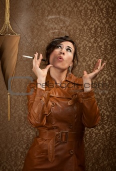 Woman in dark leather coat with cigarette