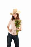 Pretty young brunette woman with cowboy hat and flowers