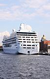 luxury white cruise ship shot at angle at water level 