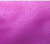 Liquid drops on purple background