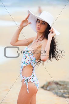 Attractive Young Woman Wearing a Swimsuit and a Hat