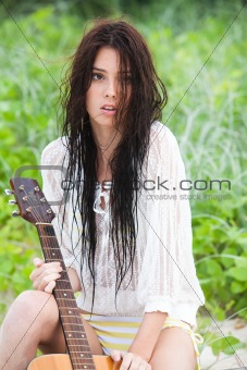 Attractive Young Woman With Guitar