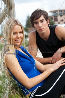 Young Couple By Fence