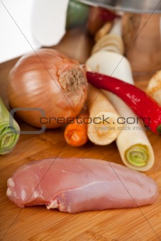 preparing a chicken soup with breast meat