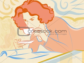 A woman having a cup of tea while reading