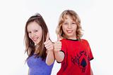 happy boy and girl with their thumbs up - isolated on white