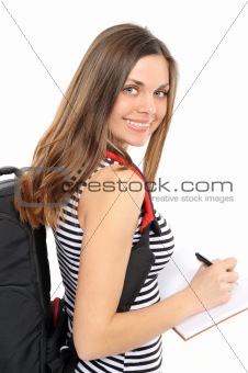  beautiful girl with a backpack, holds the book