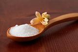 Caster sugar in a wooden spoon