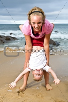 girl and boy having fun at the beach
