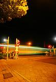 Railroad crossing at night of a Metro
