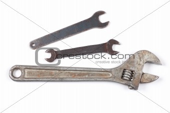 Old rusty wrench isolated on a white background shadow below.