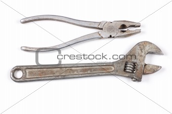 Wrench and flat-nose pliers isolated on a white background shado