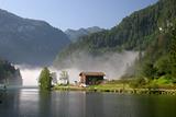 Morning fog lake Königssee in the german Alps