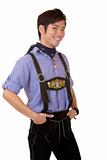Closeup of happy young man dressed in Bavarian Oktoberfest leather trousers