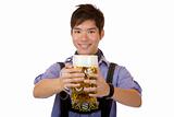 Young happy man holding Oktoberfest beer stein (Mass) in in came