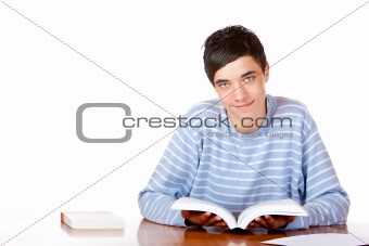Young happy handsome male student reading open study book