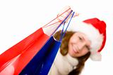 Young attractive smiling Santa Claus woman doing Christmas shopp