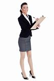 Full length of business woman writing in pad
