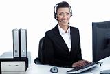 Pretty business woman working at office wearing headset