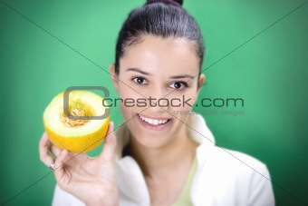 Smiling girl holding melon