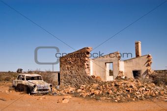 old car and ruins