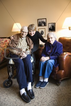 Middle-aged daughter with elderly mother and father.